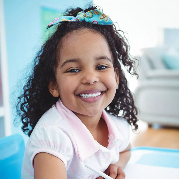 Curly Little Girl With a Beautiful Smile