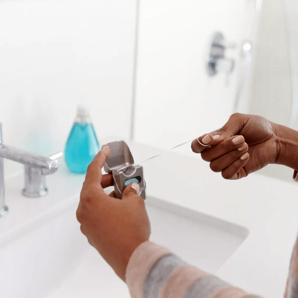 Woman holding a dental floss